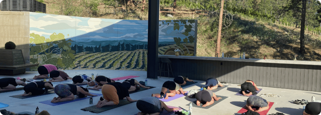 Solvero's Yoga event, Patio photo with participants in child pose